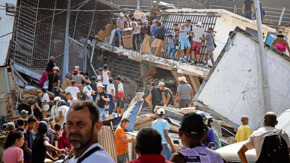 Portugal and Venezuela mourn the dead following chaos of double earthquake