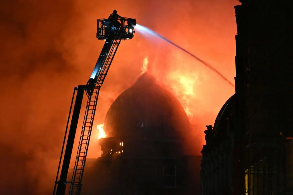 TOPSHOT - Fire fighters work to control a large fire in Glasgow City centre on March 8, 2026. (Photo by ANDY BUCHANAN / AFP)