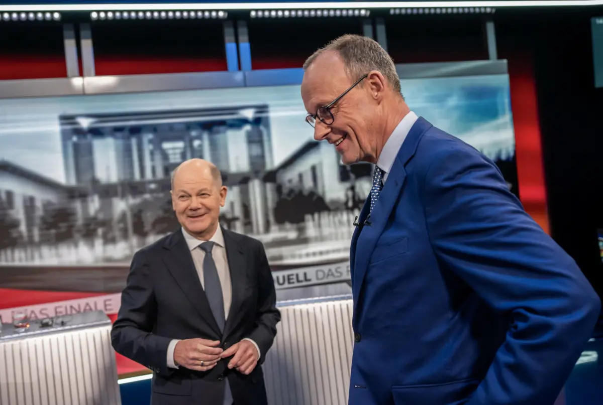 Olaf Scholz, atual chanceler alemão, e o rival conservador Friedrich Merz