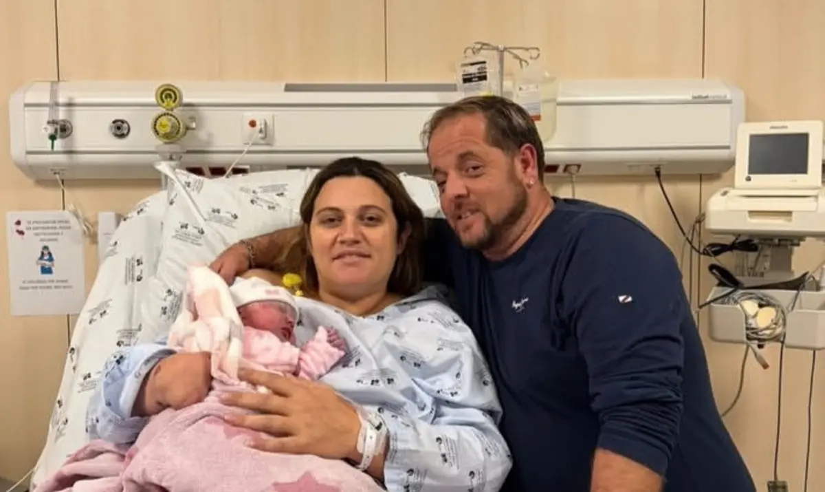 Vitória com os pais