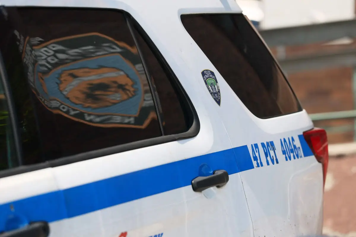 NEW YORK, NEW YORK - JULY 29: The 47th precinct of the New York Police Department (NYPD) logo is seen on a patrol car on July 29, 2025 in the Edenwald neighborhood of the Bronx Borough in New York City. Off-duty NYPD officer Didarul Islam, who was stationed at the 47th NYPD precinct, was one of four people killed in a Midtown mass shooting while working during a private security detail assignment. Islam was the father of two and his wife is expecting a third child next month. A fifth victim was critically injured and the shooter took his life before being apprehended. Michael M. Santiago/Getty Images/AFP (Photo by Michael M. Santiago / GETTY IMAGES NORTH AMERICA / Getty Images via AFP)