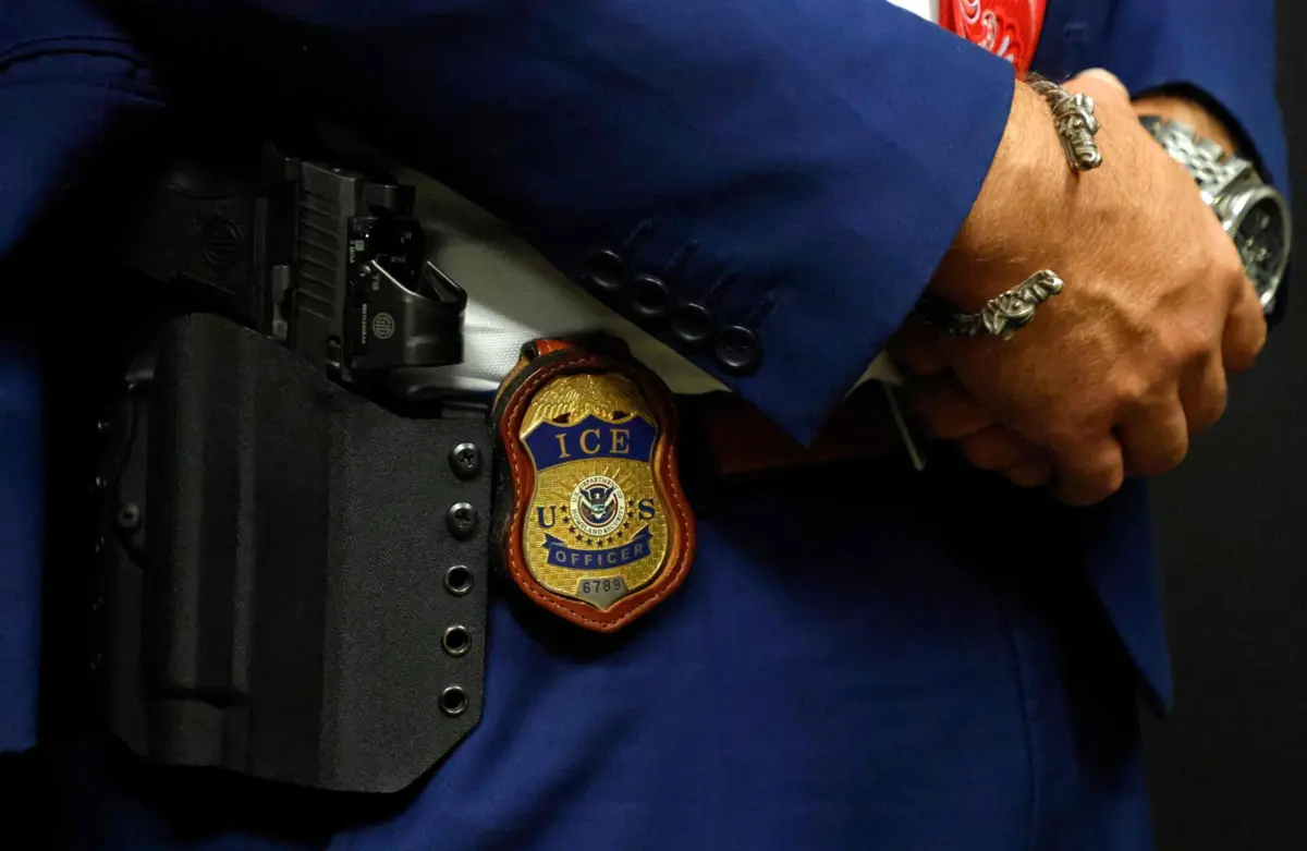 ARLINGTON, TEXAS - AUGUST 26: A detail view of the badge worn by Matthew Elliston, deputy assistant director of field operations at ICE headquarters in Washington. U.S. Immigration and Customs Enforcement (ICE) hold a major hiring event on August 26, 2025 in Arlington, Texas. The federal immigration agency is ramping up recruiting efforts nationwide. Ron Jenkins/Getty Images/AFP (Photo by Ron Jenkins / GETTY IMAGES NORTH AMERICA / Getty Images via AFP)