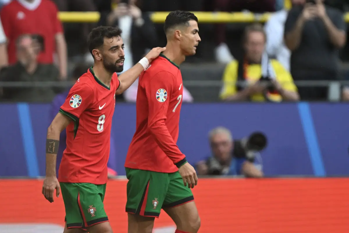 Bruno Fernandes e Ronaldo (Créditos: AFP)