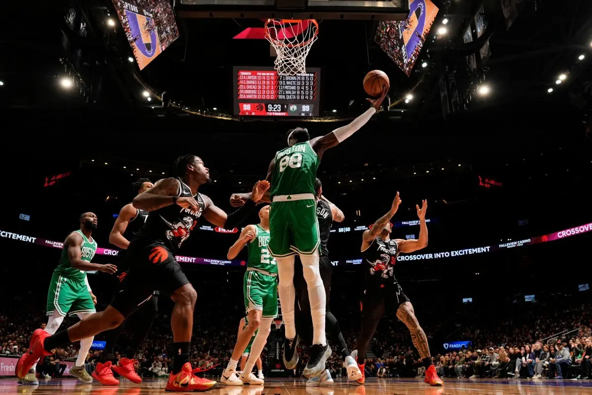 TORONTO, CANADA - DECEMBER 7: Neemias Queta #88 of the Boston Celtics drives to the basket during the game against the Toronto Raptors on December 7, 2025 at the Scotiabank Arena in Toronto, Ontario, Canada. NOTE TO USER: User expressly acknowledges and agrees that, by downloading and or using this Photograph, user is consenting to the terms and conditions of the Getty Images License Agreement. Mandatory Copyright Notice: Copyright 2025 NBAE Mark Blinch/NBAE via Getty Images/AFP (Photo by MARK BLINCH / NBAE / Getty Images / Getty Images via AFP)