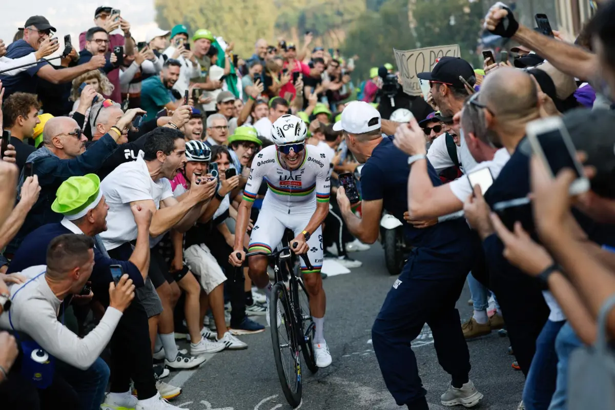 UAE Team Emirates"s Slovenian rider Tadej Pogacar cycles in a lone breakaway in the final ascent to Bergamo to win the 119th edition of the Giro di Lombardia (Tour of Lombardy), a 238km cycling race from Como to Bergamo on October 11, 2025. (Photo by Luca BETTINI / POOL / AFP)
