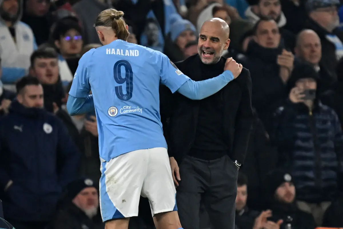 Haaland com Guardiola (Créditos: AFP)