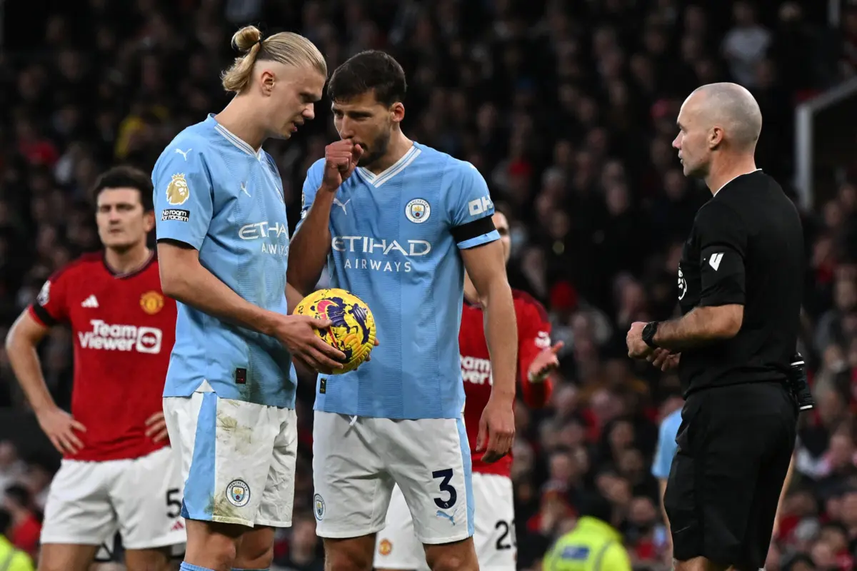 Haaland e Rúben Dias (Créditos: AFP)
