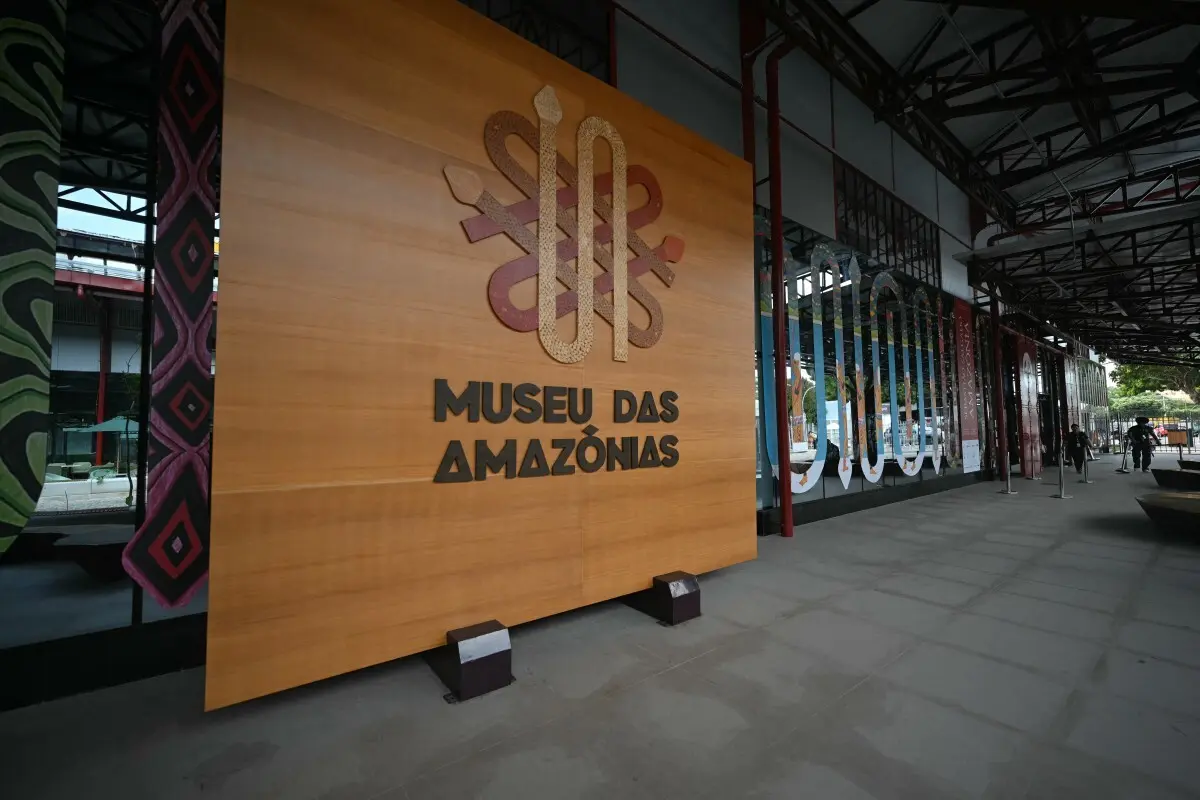 View of the entrance to the Museu das Amazonias at the dock area during the COP30 UN Climate Change Conference in Belem, Para State, Brazil, on November 11, 2025. The COP30 runs from November 10 to 21, and the 50,000 participants will feel the heavy, humid air of the Amazon rainforest, and face the daunting task of keeping global climate cooperation from collapsing.. (Photo by Mauro PIMENTEL / AFP)