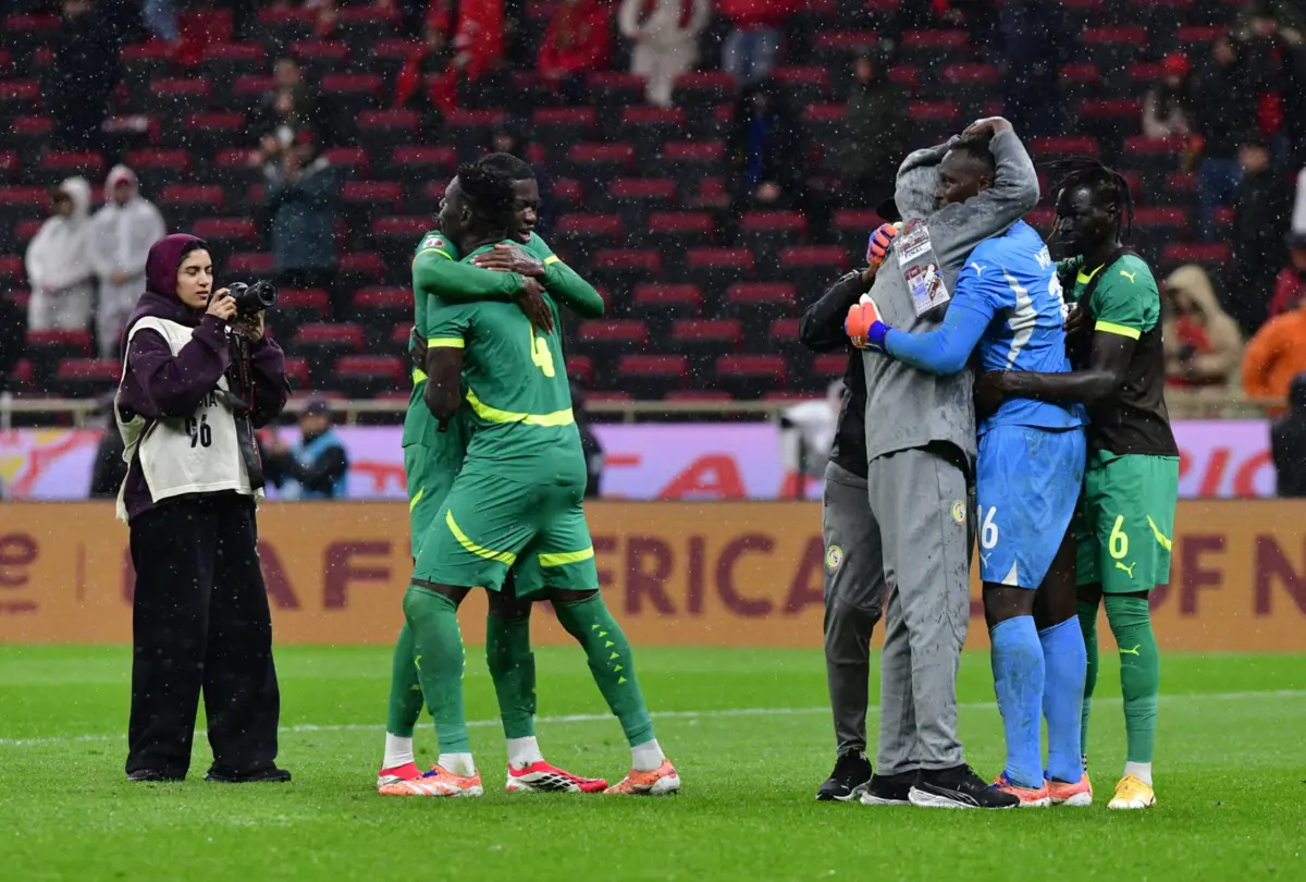 epa12659880 Players of Senegal celebrate winning the CAF Africa Cup of Nations 2025 final match between Senegal and Morocco in Rabat, Morocco, 18 January 2026. EPA/JALAL MORCHIDI
