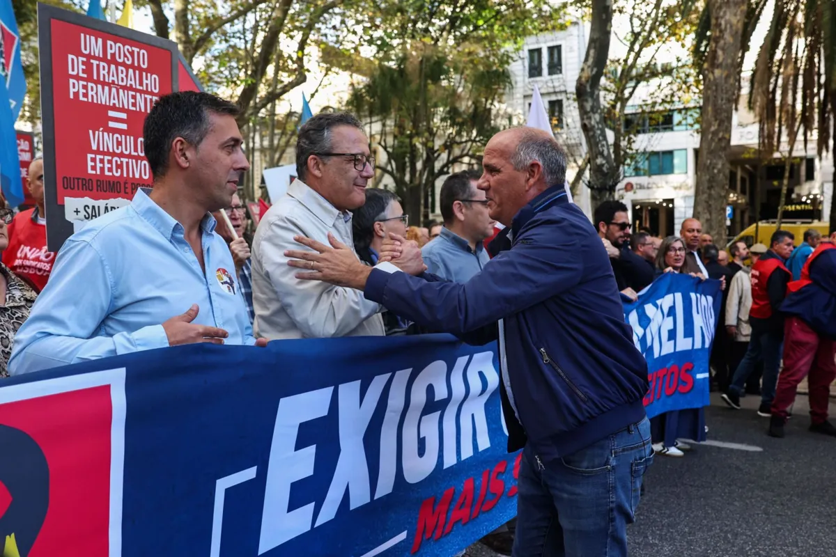 CGTP-IN union secretary-general, Tiago Oilveira (L), and Portuguese Communist Party (PCP) secretary-general, Paulo Raimundo (R), during the demonstration of thousands of workers convened by the General Confederation of Portuguese Workers - National Inter-Union (CGTP-IN) to protest against changes to labor law in Lisbon, Portugal, November 8, 2025. The government's draft proposal for revising labor legislation, which is being debated with social partners, foresees the revision of "more than a hundred" articles of the Labor Code. ANTONIO COTRIM/LUSA