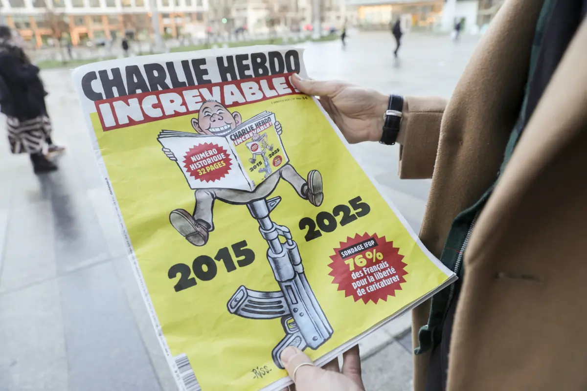 Imagem de contexto do artigo "Não quero proibir-me de ser livre." Numa redação sem janelas, cartoonistas do Charlie Hebdo vivem sob ameaça constante