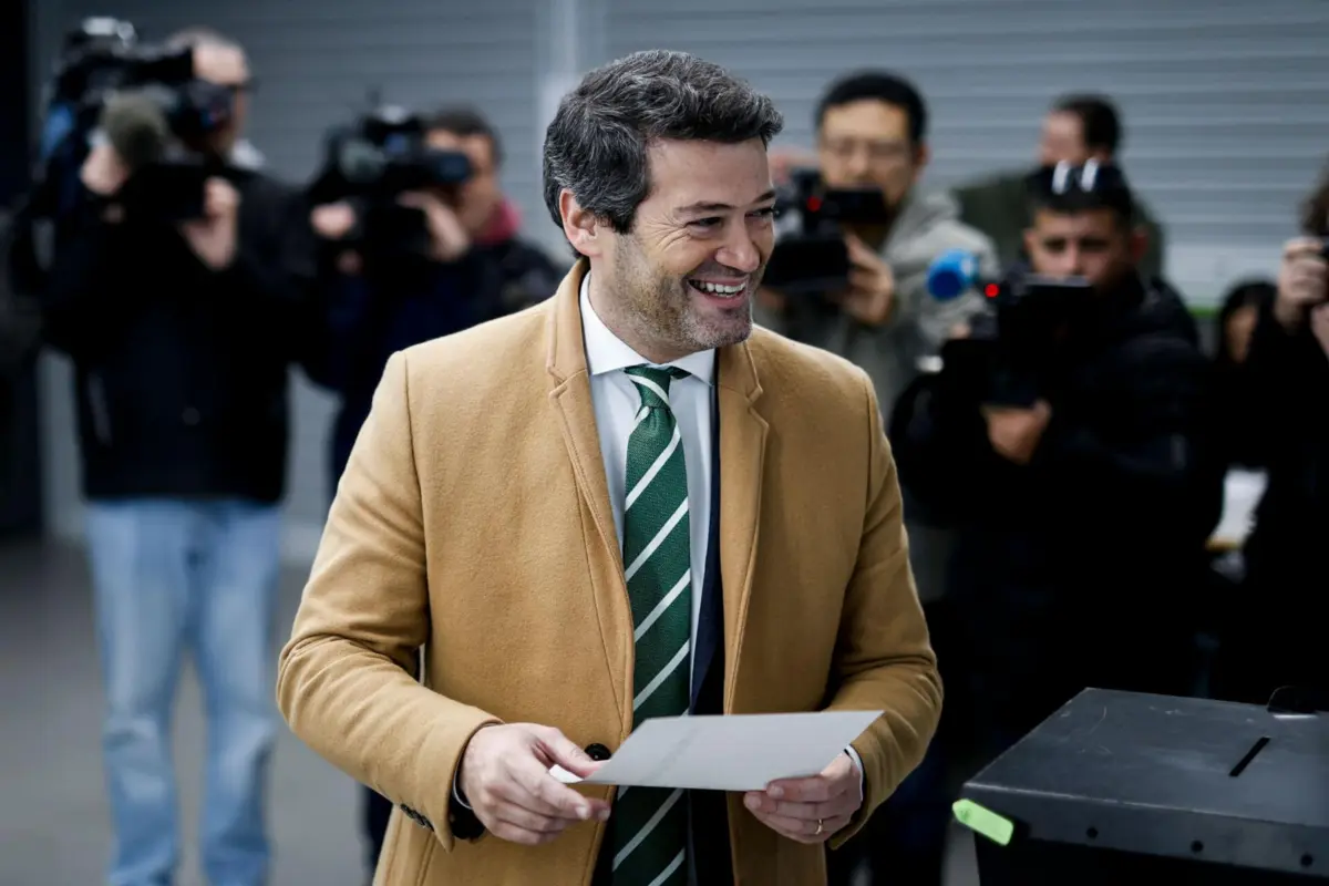 Presidential candidate and leader of the far-right Chega ("Enough") party, Andre Ventura prepares to cast his vote for Portugal's presidential elections at a polling station in Lisbon on January 18, 2026. Portugal started voting in the first round of a presidential election in which a far-right candidate could for the first time make it to a run-off, but with the final result hard to call. (Photo by FILIPE AMORIM / AFP)